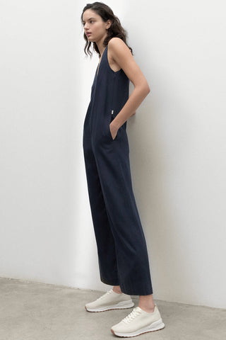 Model wearing navy relaxed fit wide leg Turquesa Jumpsuit by Ecoalf. 