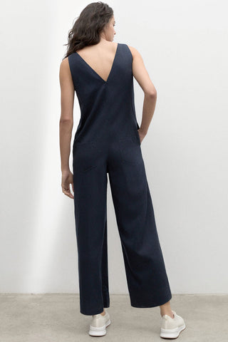 Back view of model wearing navy relaxed fit wide leg Turquesa Jumpsuit by Ecoalf. 