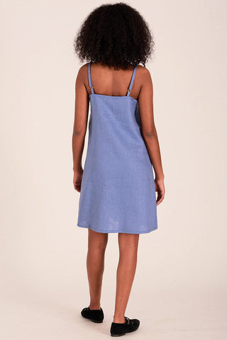 Back view of model wearing blue OEKO-TEK linen Drew slip dress. 