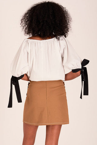 Back view of model wearing white and black Eliza Faulkner Sally blouse. 