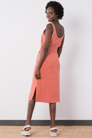 Back of view model wearing terra cotta linen blend Aisha Dress by Jennifer Glasgow. 
