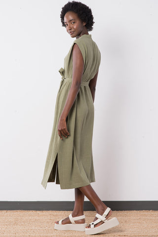 Side view of model wearing sage linen blend button up Helena Dress by Jennifer Glasgow. 