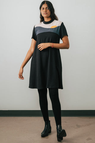 Model wearing Jennifer Glasgow Vanora A-line colour blocked dress in black OEKO-TEK linen blend.