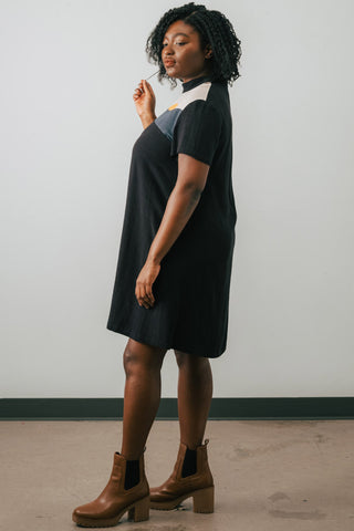 Side view of model wearing Jennifer Glasgow Vanora A-line colour blocked dress in black OEKO-TEK linen blend.