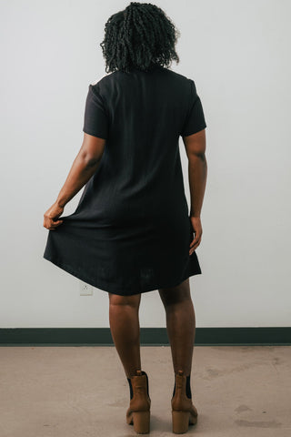 Back view of model wearing Jennifer Glasgow Vanora A-line colour blocked dress in black OEKO-TEK linen blend.