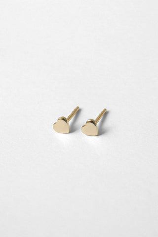 Gold heart shaped Aimee Stud earrings by Kara Yoo. 