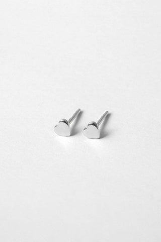 Silver heart shaped Aimee Stud earrings by Kara Yoo. 