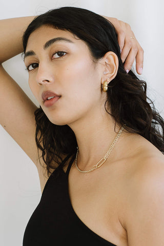 Model wearing gold vermeil Hazel Hoop earrings by Kara Yoo. 
