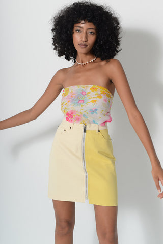 Model wearing two-tone yellow denim Billie Skirt by Kurt Lyle. 