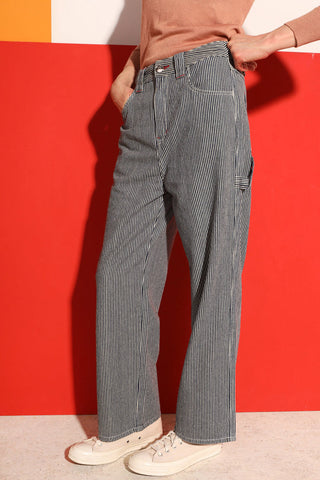 Model wearing railroad stripe workwear inspired LF Markey Hart Trouser. 