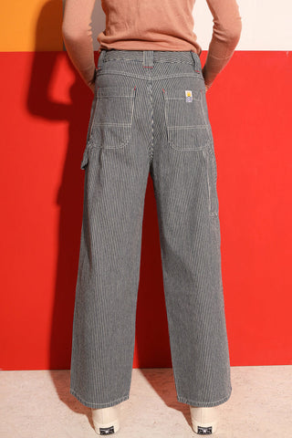 Back view of model wearing railroad stripe workwear inspired LF Markey Hart Trouser. 