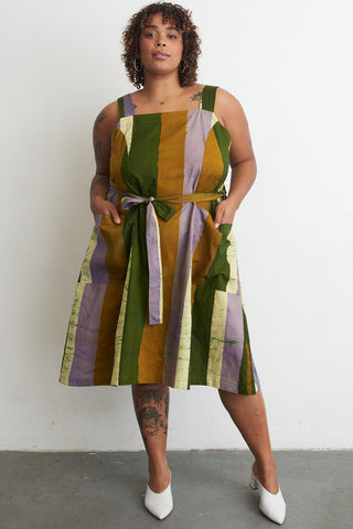 Model wearing organic cotton A-Line Osei Duro dress in Speedboat print. 