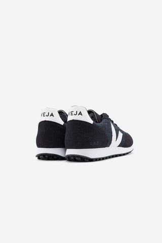 Side view of black and white vintage inspired flannel SDU sneakers by Veja. 