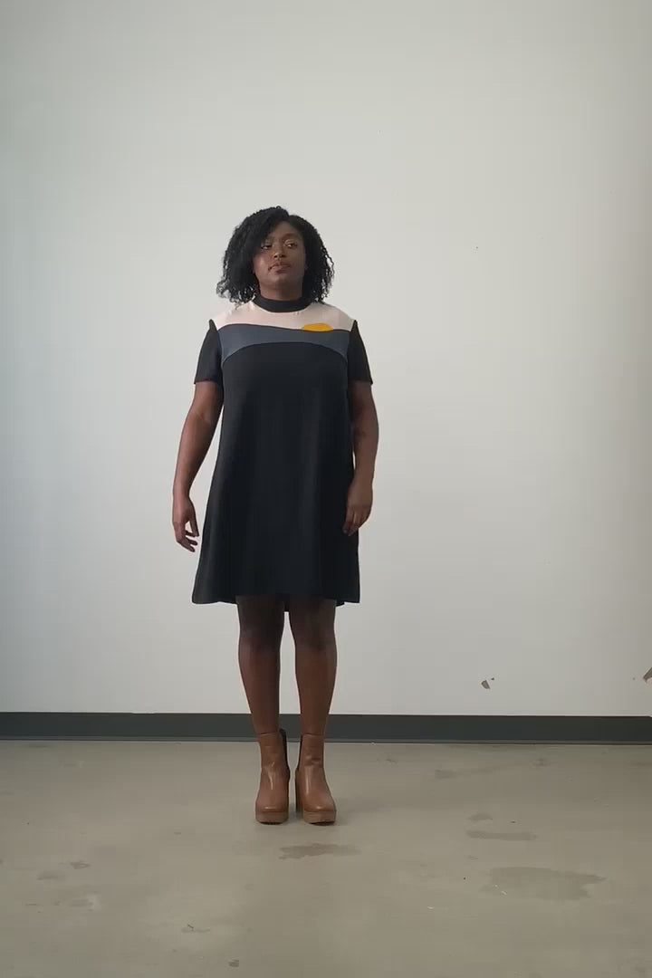 Video of model wearing Jennifer Glasgow Vanora A-line colour blocked dress in black OEKO-TEK linen blend.