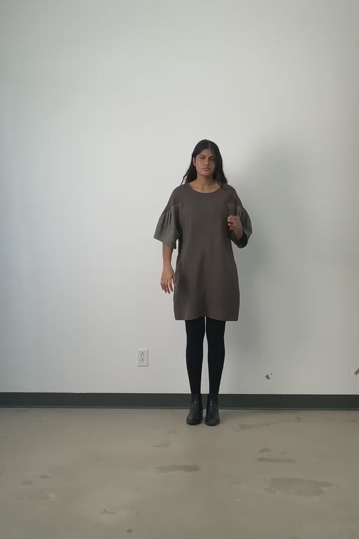 Video of model wearing Jennifer Glasgow Yara dress in olive tencel.